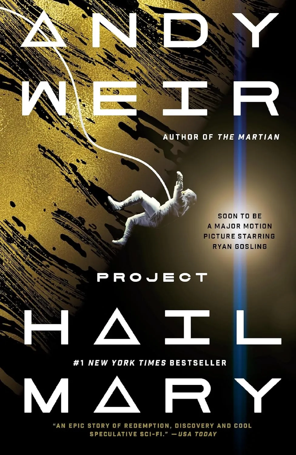 Book cover for Project Hail Mary by Andy Weir: a gold-and-black abstract space scene with large white lettering, showing a small astronaut floating diagonally across the center, tethered by a thin white line. Text notes “Author of The Martian,” “#1 New York Times bestseller,” and “Soon to be a major motion picture starring Ryan Gosling.”