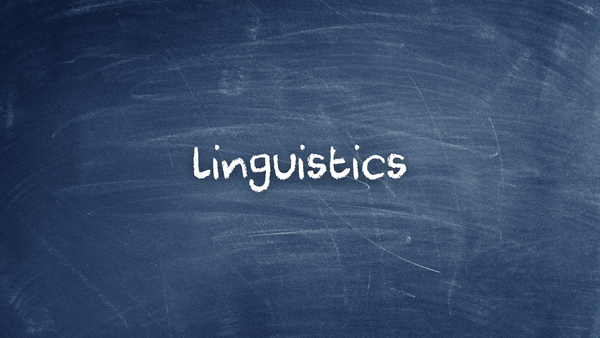 The text "linguistics" written in chalk on a blackboard.